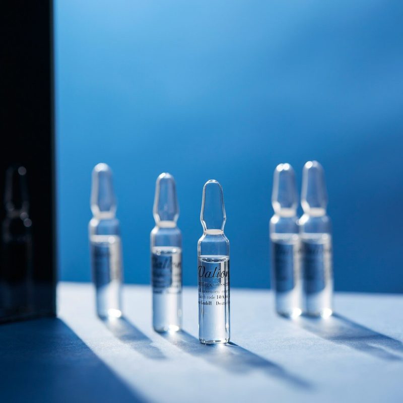 a group of glass bottles sitting on top of a table